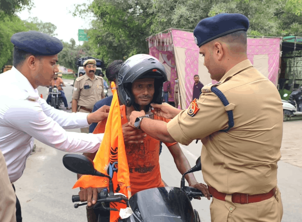 Amroha SP Fits Helmets on Kanwar Pilgrims, Urges Safe Journey